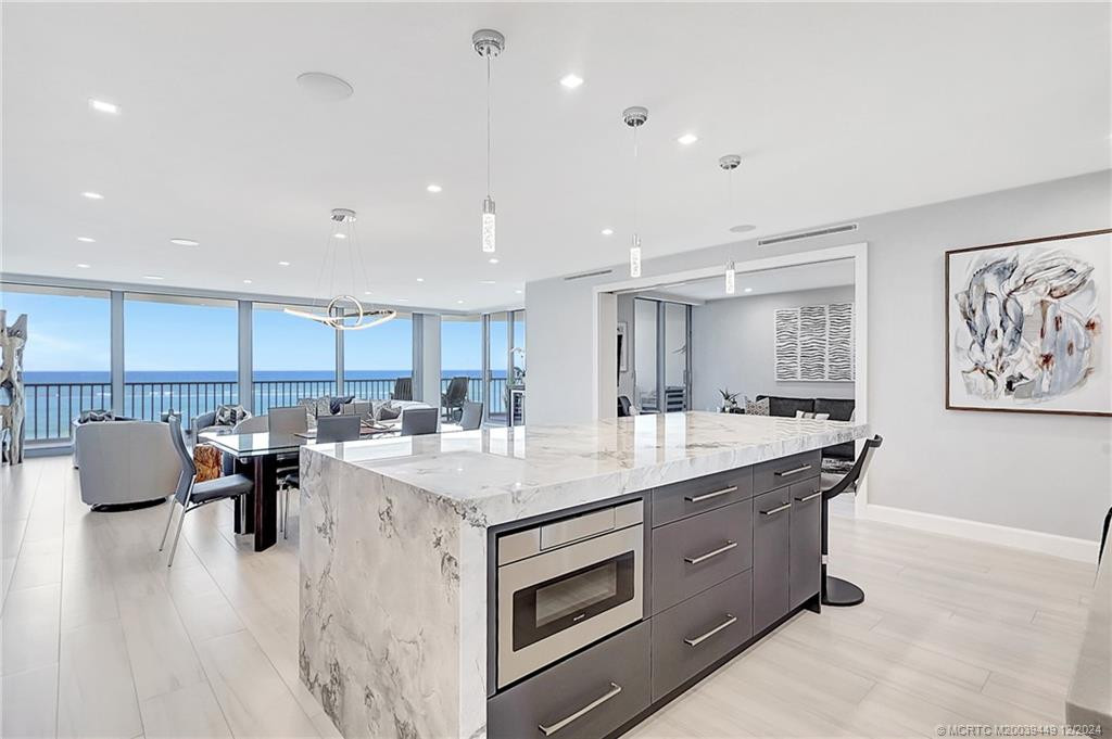 Island hosts a Sharp microwave drawer and extra storage