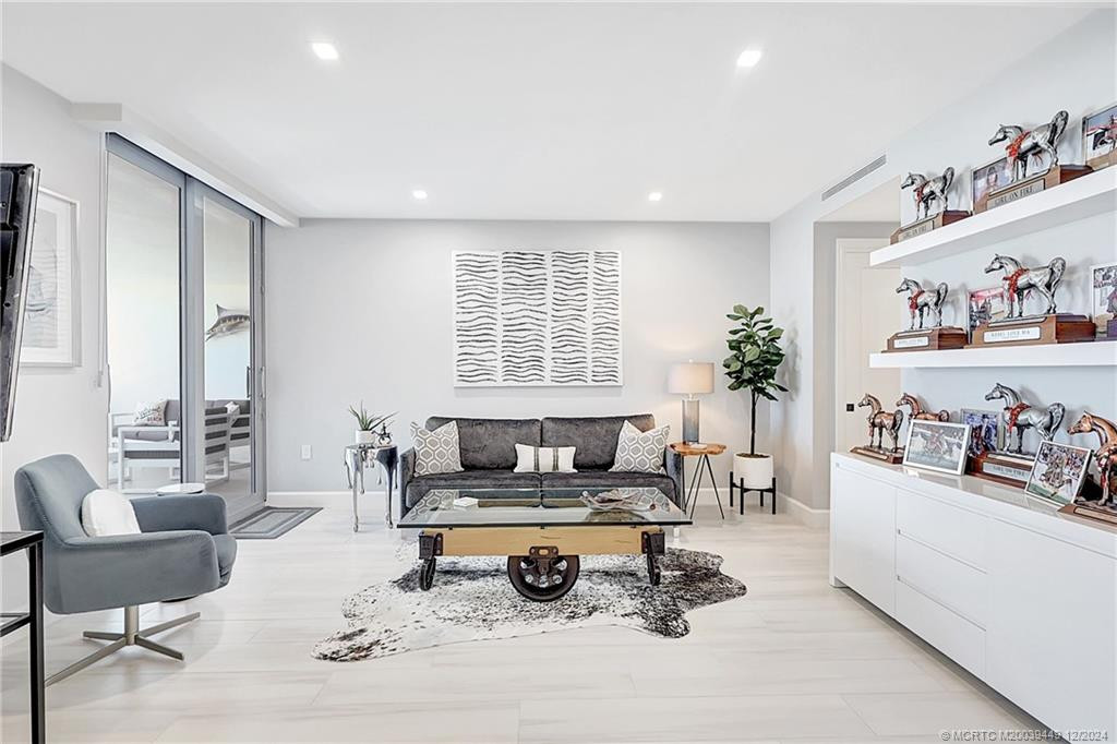 A custom sliding wall easily converts this bedroom to a den