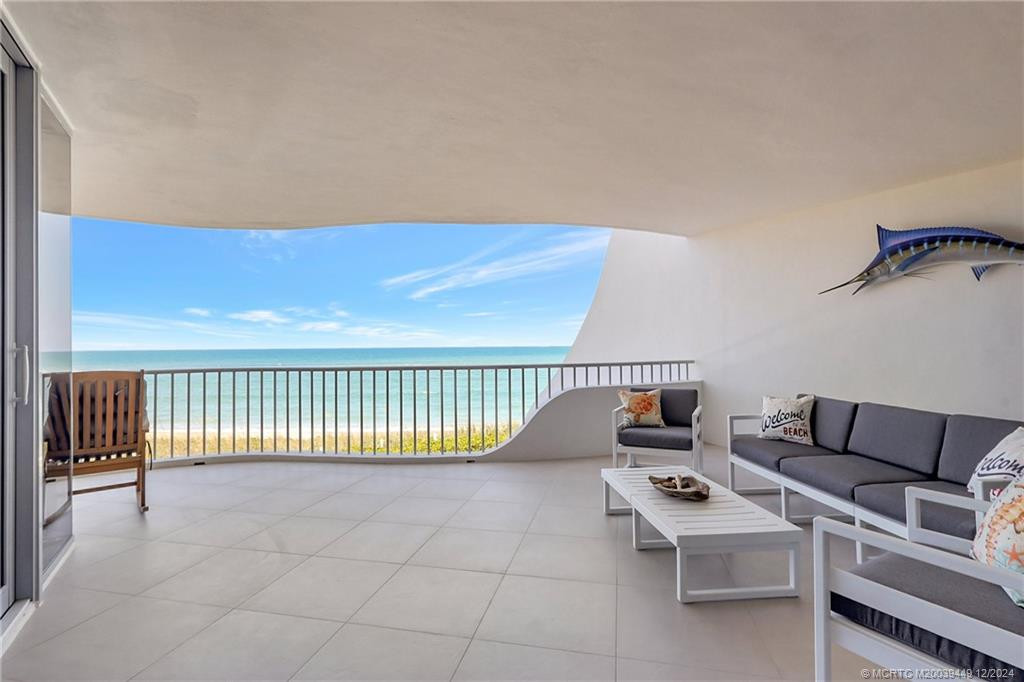 Take in the view under the cover of shade and breathe in the fresh sea air