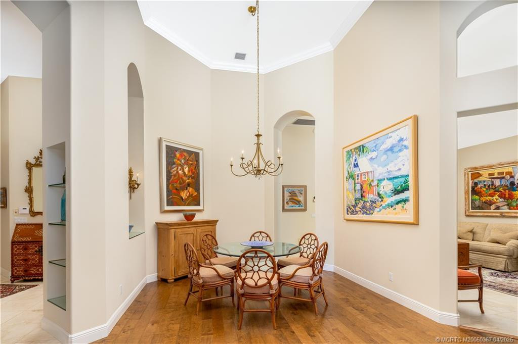 Steps from living area with kitchen directly behind
