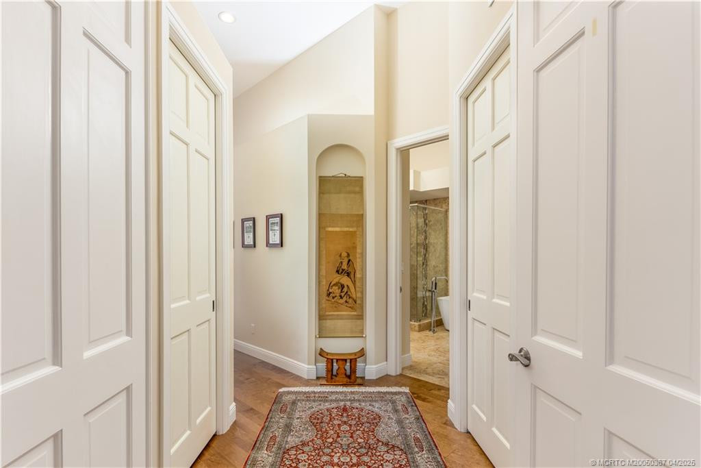 Entry to Primary Suite with walk-ins on each side