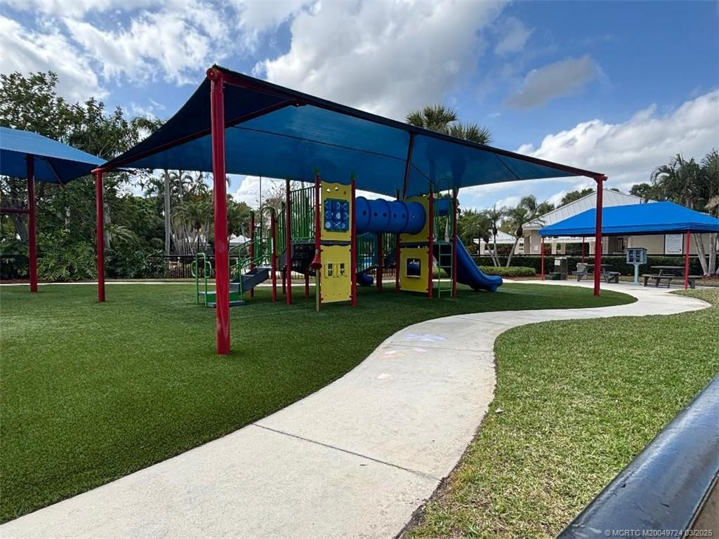Playground next to community pool