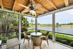 L-Shaped Screened-In Patio With Views of Lake and Golf Course