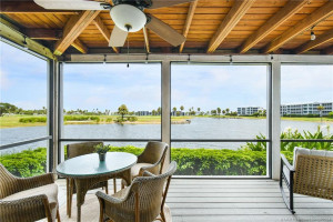 L-Shaped Screened-In Patio With Views of Lake and Golf Course