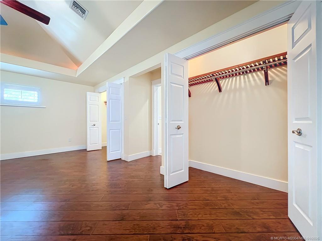 This is the window on the other side of the room, to the right is the French doors impact glass out to the screened patio. Looking at the beautiful bacl yard.