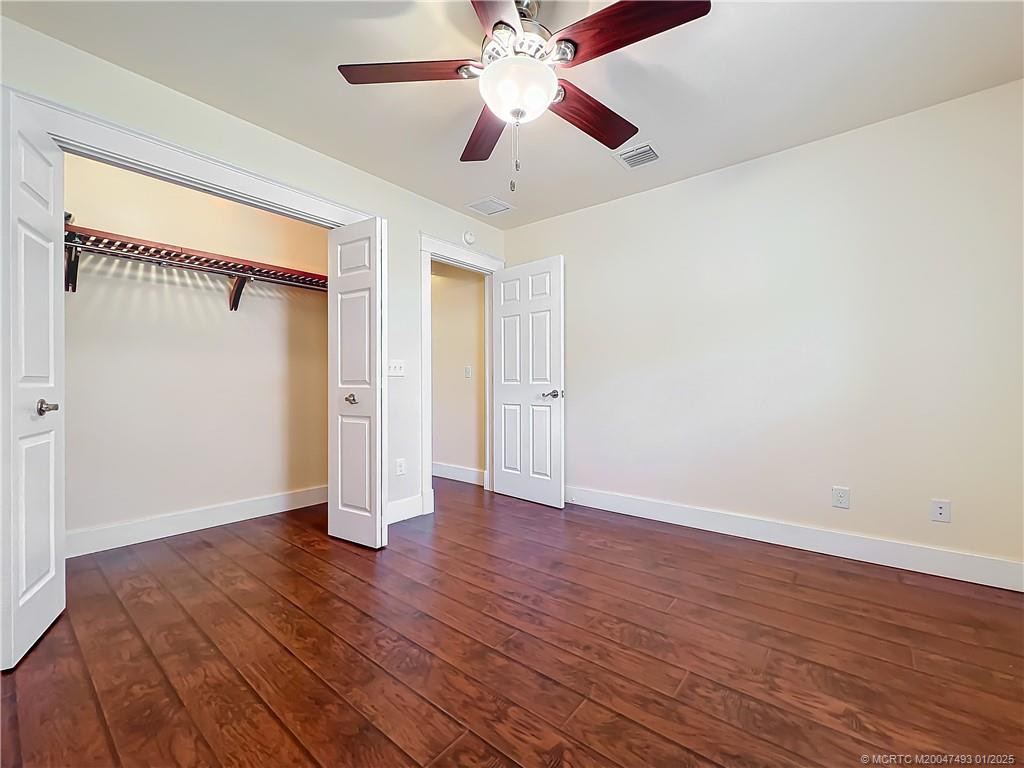 Laminate floors. fand with a light. Windows with plantation shutters . All windows are impact glass.