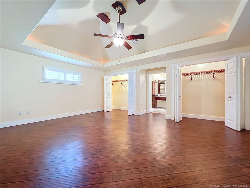 Look at this oversized primary bedroom, 2 closets, French impact glass doors out to the screened porch with plantation shutters. high ceilings with lighting, fan with a light. Flows into a large primary bathroom with a large shower with double heads one on each side of the shower. You must see this beauty in person. All updated.