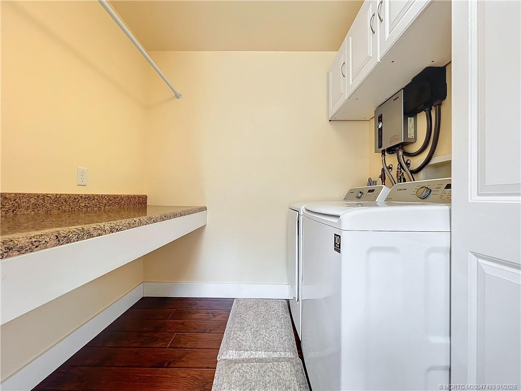 Washer and dryer with a folding area and you can hang you clothers to dry.