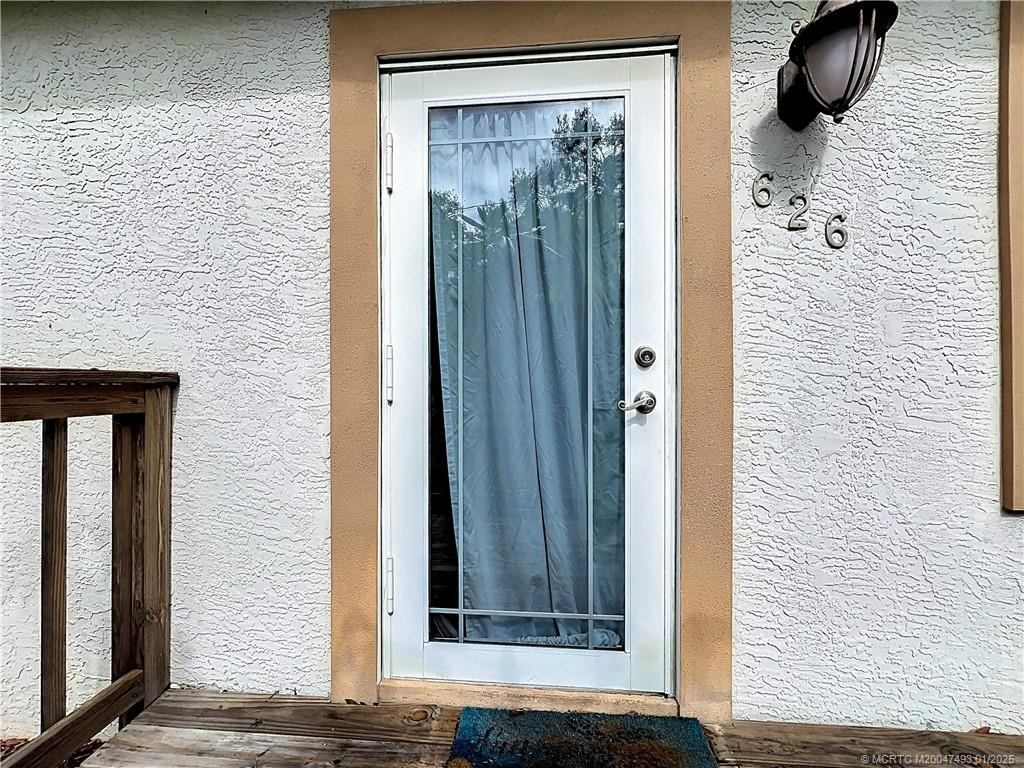 Front porch with an impact French door.