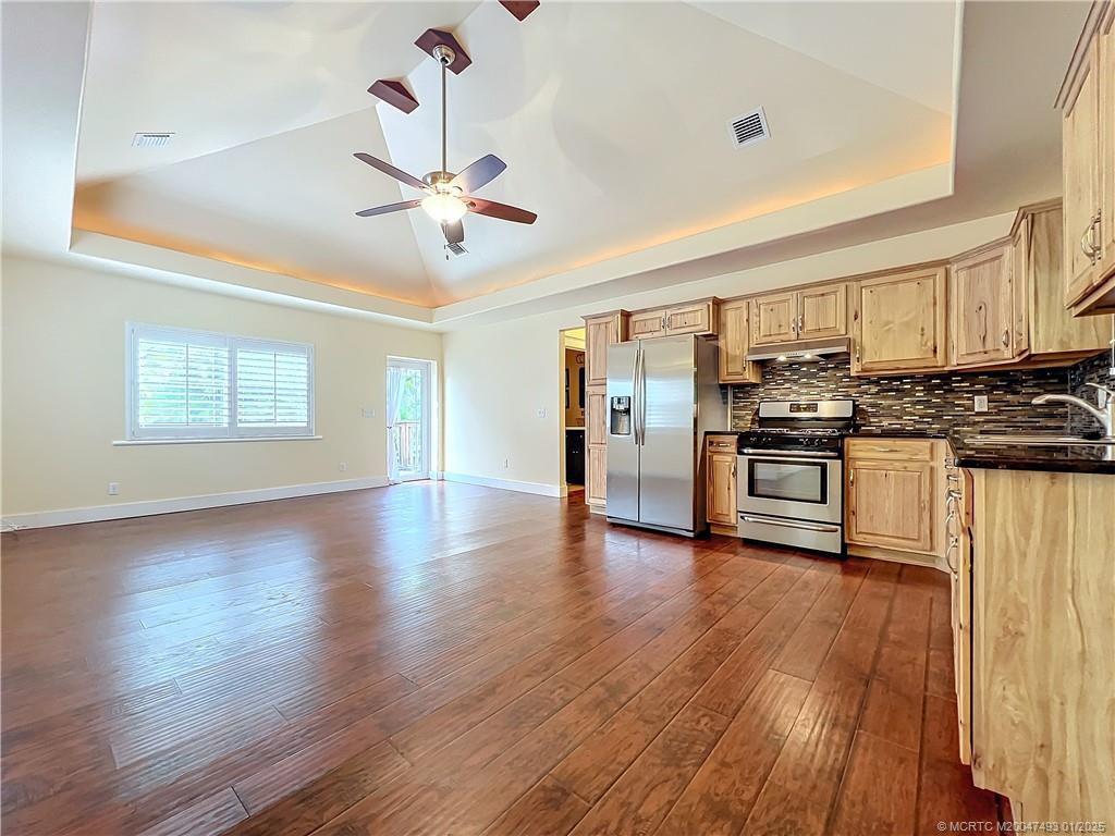 Lots of light and impact hurricane glass. Plantation shutters. Stove is gas, tank is outside.