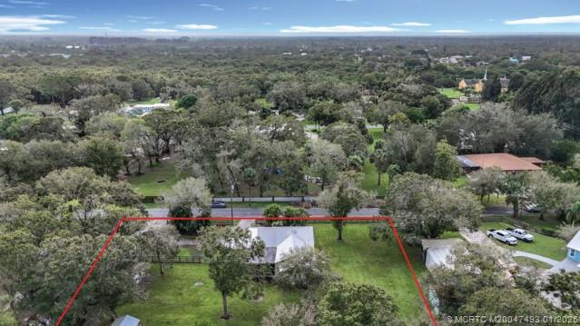 Much more land than you can see. over a half-acre
