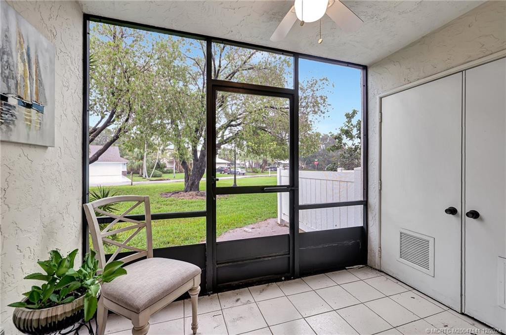 Screened patio with large storage closet.
