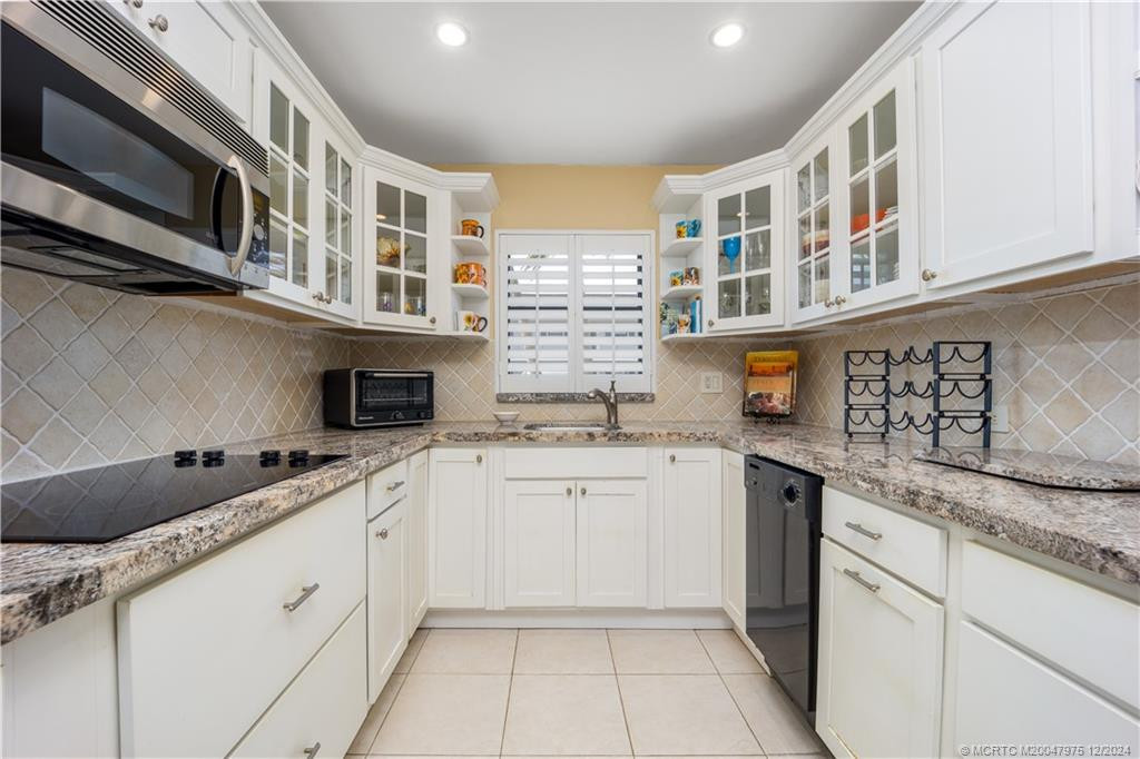 Tastefully updated kitchen with granite counters.