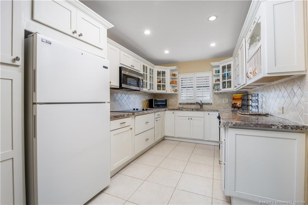 Custom cabinetry with pull-out shelving.