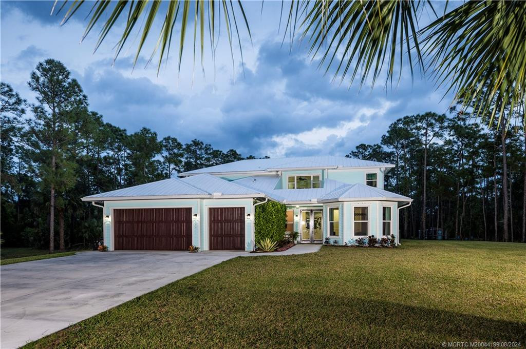 Key West in the Country! offering a unique blend of luxury and meticulous design nestled in Palm City Farms. This custom 6-bedroom, 4-bathroom home, crafted by renowned architect Joe McCarty, epitomizes sophistication. Sponsored by the Florida Solar Energy Center, it boasts energy-efficient features. The spacious two-story layout features an open living area and a magnificent second-story balcony overlooking the lush 5-acre lot. Additionally, the property even includes "The Chicken Mansion".