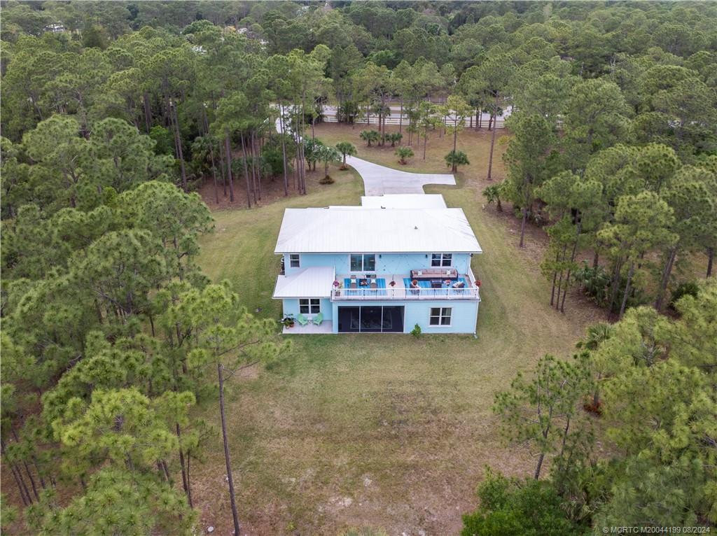 5 acres of lush wooded landscape. Privacy from every room.