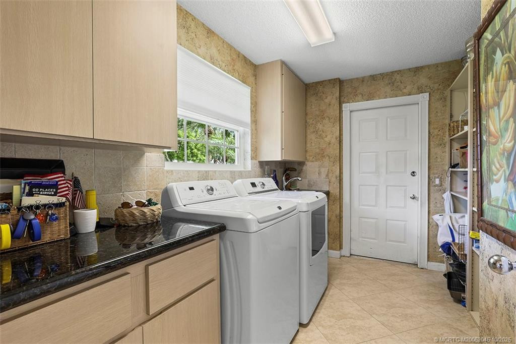 The laundry includes a full pantry and garage access