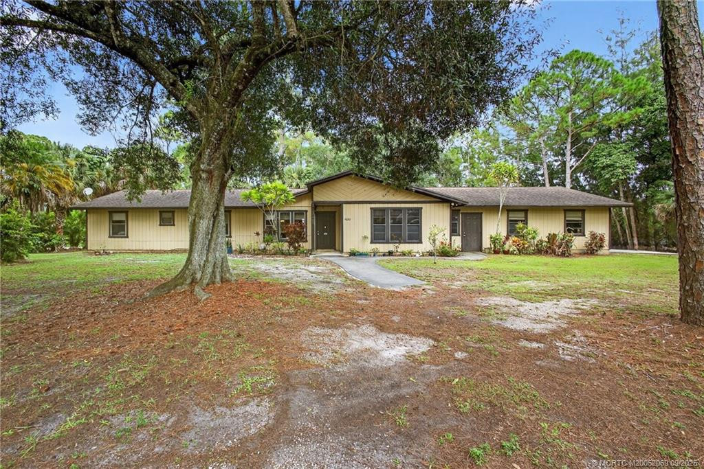Exterior view of your home nestled on 1.25 acres