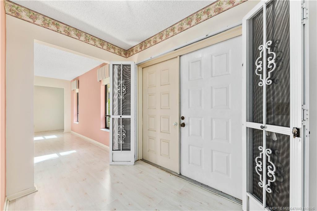 Foyer at 2106 NW Greenbriar Lane, Palm City