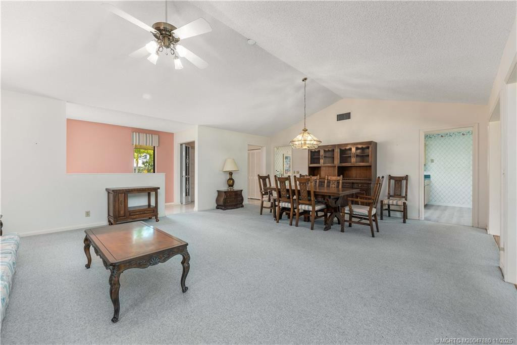 Living Room with Dining at 2106 NW Greenbriar Lane, Palm City