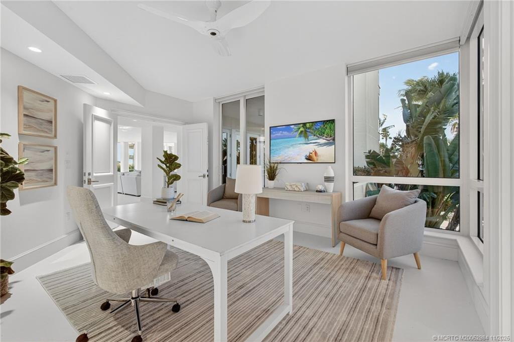 With door to balcony and motorized shades