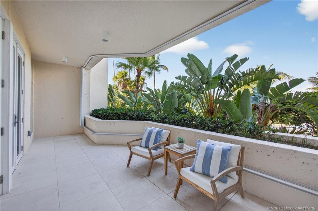 West facing balcony with accordion shutter