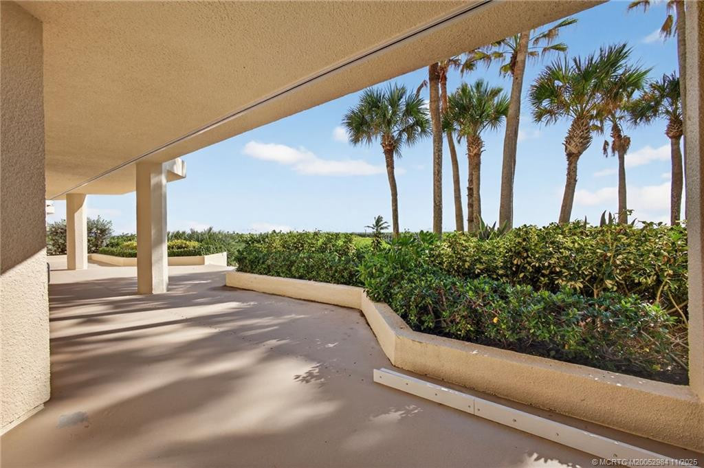 A view with a perfect blend of sky, ocean, and greenery