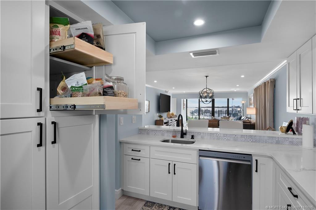 Kitchen w/ multiple slide outs & pantry.