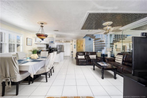 Dining and family rooms flank kitchen for gatherings.