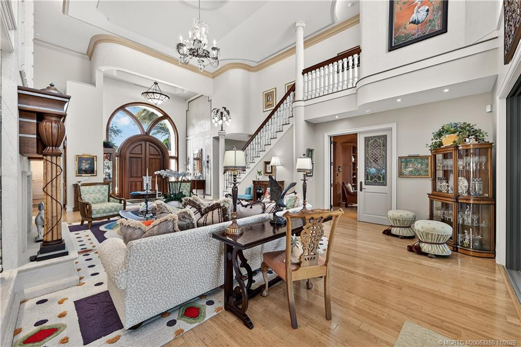 Hand-crafted finishes including crown moldings, doors, and staircase.