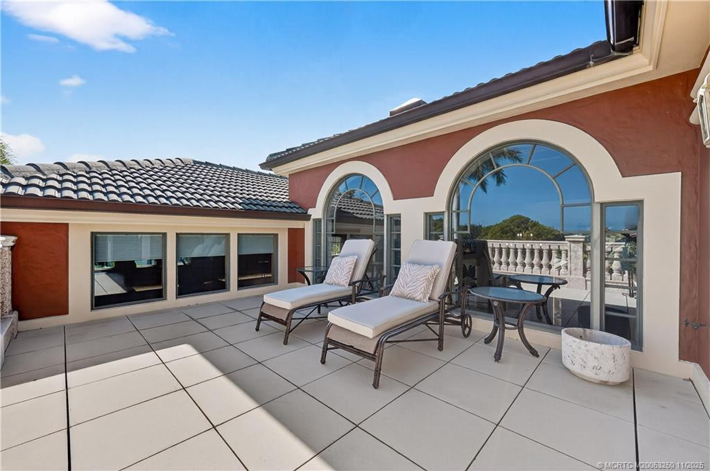 Sun Deck off Primary Suite - Coffee in the Morning / Cocktails in the Evening. Overlooks lush fairway and St. Lucie River.