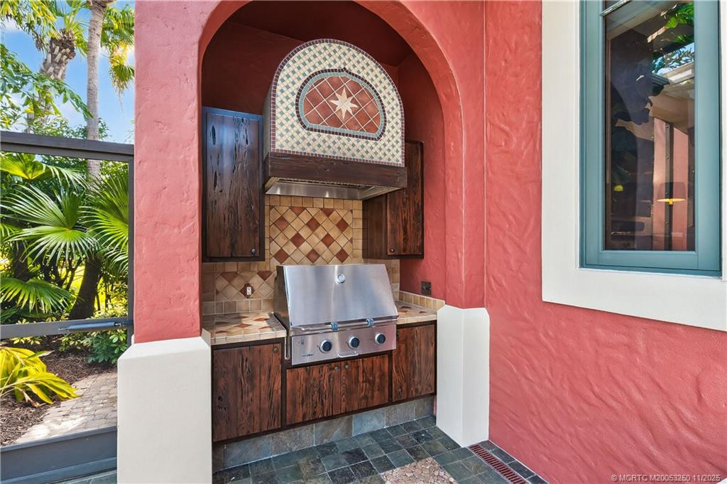 Outdoor Kitchen with Custom Cabinetry & Tile