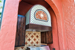 Custom Tile & Cabinetry surrounds the Outdoor Grille area.