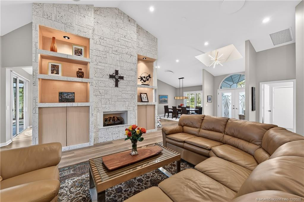 Living Room with Fireplace at 12797 NW Mariner Court, Palm City
