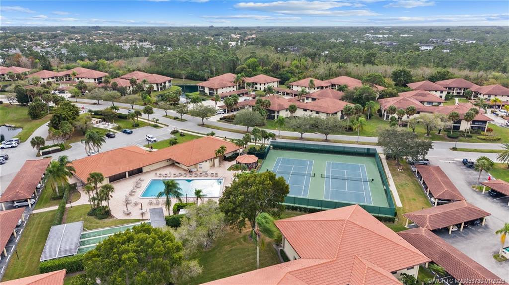 Clubhouse, Community Pool, Tennis Courts and Bocce Ball Courts right across the street from owner's building.