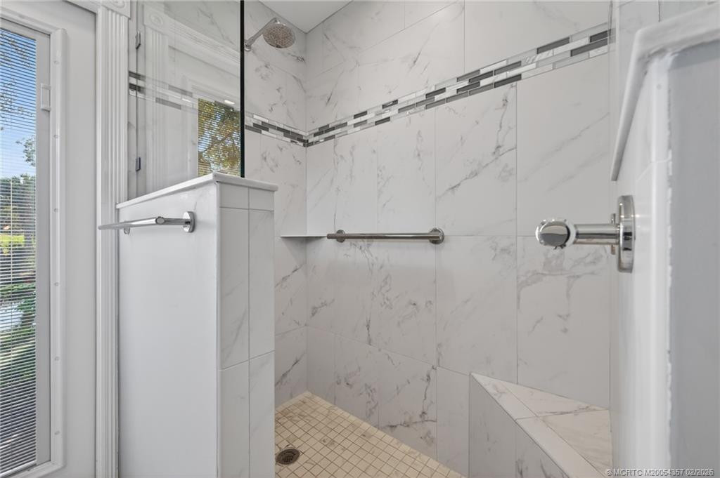 Volume ceilings, 24" tile flooring with new waterproof vinyl plank in bedrooms.