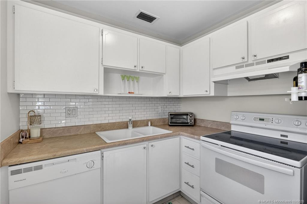 Pristine white kitchen.