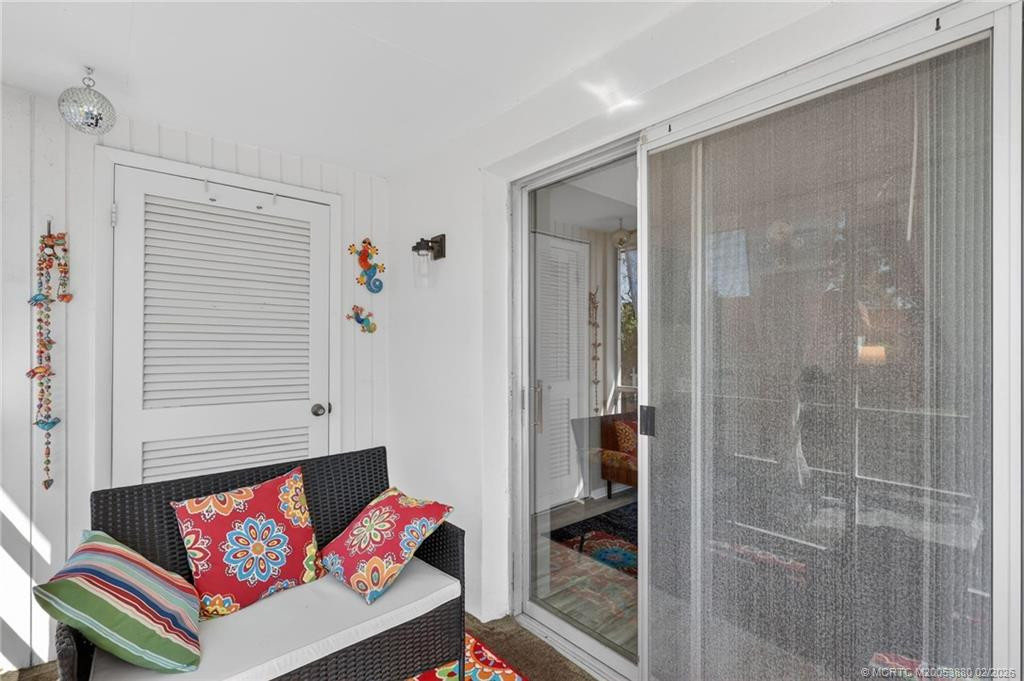Balcony space with convenient storage closet.