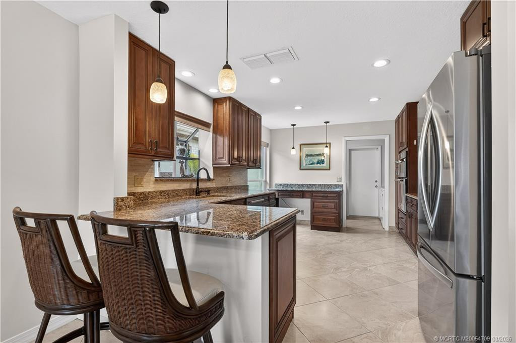 Eat in kitchen on the bar stools.
