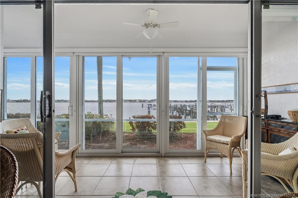 Large porch with impact glass windows