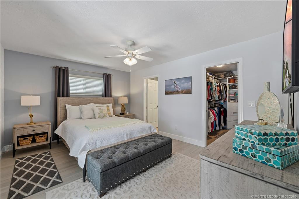 Primary bedroom with ensuite bath and walk-in closet