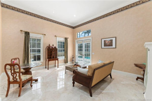 Primary Sitting Area with entrance to Pool Area
