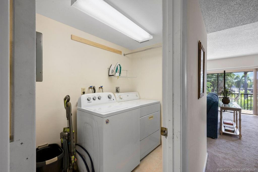 Laundry room! With full size washer & dryer in your own condo! Good storage space too