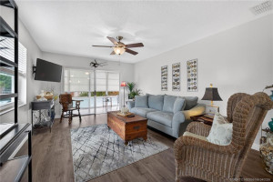 Living area opens to the enclosed lanai.