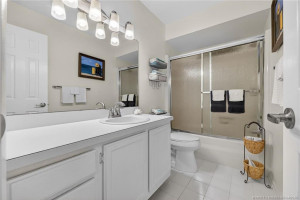 Hall bathroom with tub/shower combined.