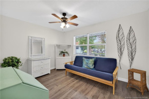 Second bedroom, luxury vinyl flooring and impact window.