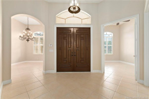 Foyer with formal dining on left and office on right
