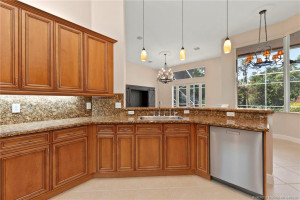 Kitchen with granite and wood cabinets