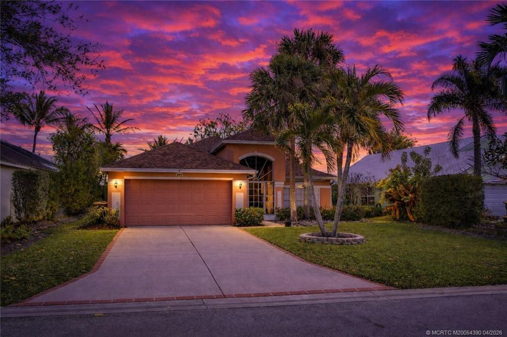 Virtual Twilight Front Exterior at 861 NW Waterlily Place, Jensen Beach