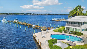 Enjoy true Florida living with three heated pools (this pool is the Riverfront pool, waterfront lounging areas, and boat docks just steps away—perfect for boating, relaxing, and soaking in the coastal lifestyle
